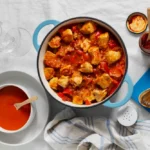 Flat lay delicious goulash on table still life