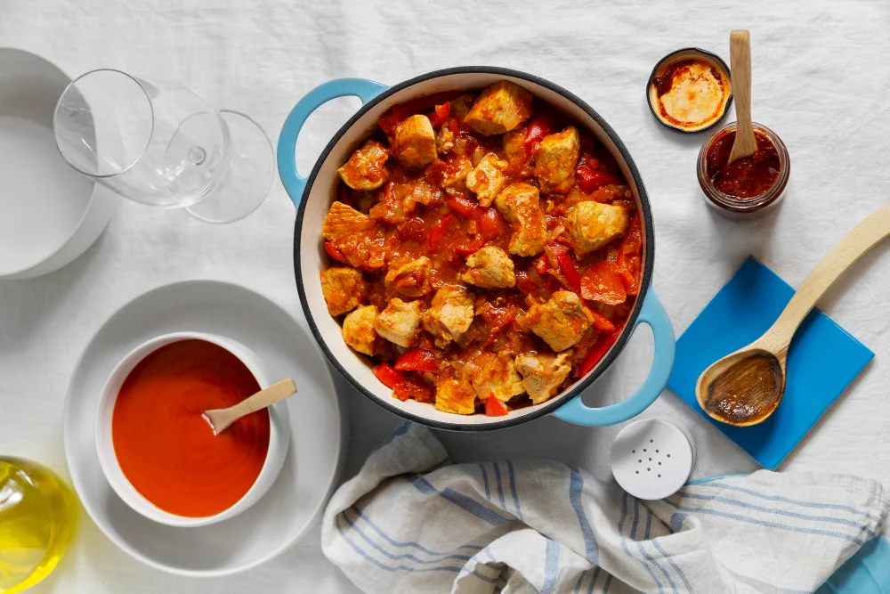 Flat lay delicious goulash on table still life