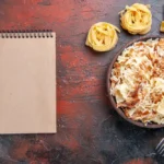 sliced cooked dough with rice on the dark surface dish meal pasta dough
