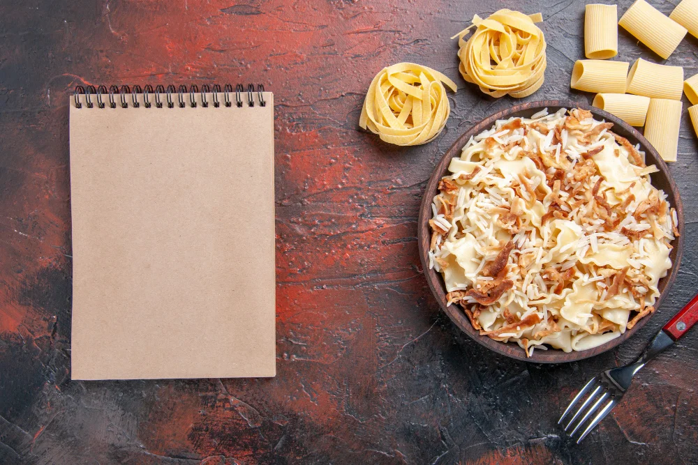 sliced cooked dough with rice on the dark surface dish meal pasta dough
