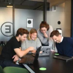 Business team discussing website strategy to choose the best CMS for SEO