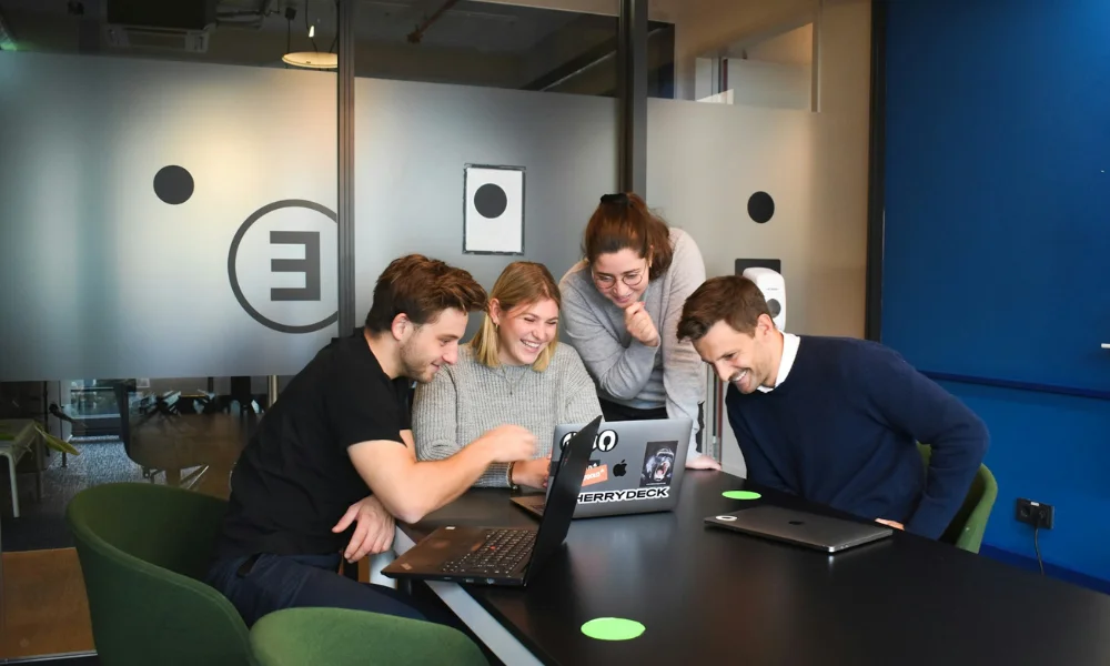 Business team discussing website strategy to choose the best CMS for SEO