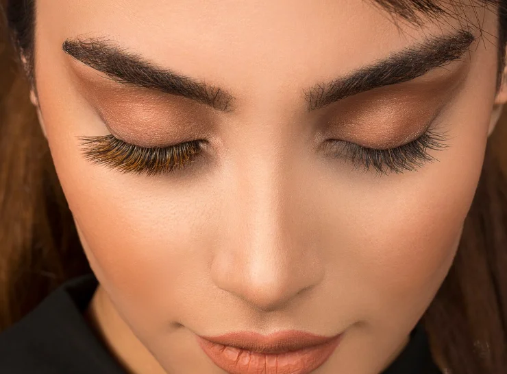 Woman with natural eyelash extensions close-up