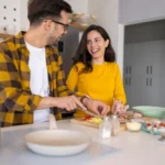 Friends preparing meal in the kitchen