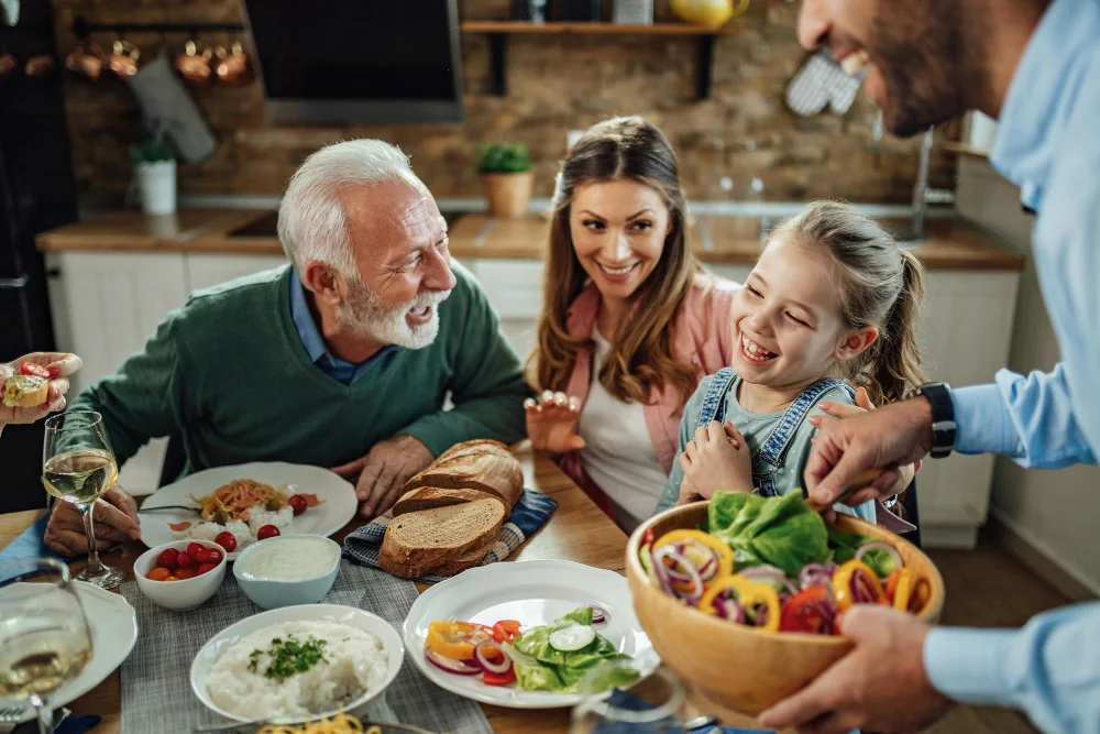 family having fun while talking during lunch