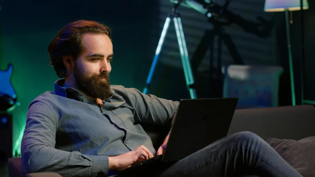 Business professional managing automated branding with laptop