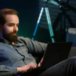 Business professional managing automated branding with laptop