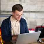 SEO specialist working on website optimisation on laptop