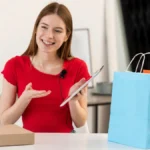 Influencer promoting Target affiliate products while recording video with shopping bags.