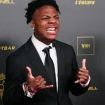 YouTuber and streamer IShowSpeed posing in a suit on the red carpet at the Ballon d'Or ceremony.