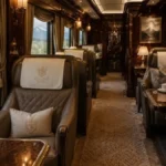 The interior of a luxury train car with plush leather seats and wood paneling, featuring a window view of the Swiss Alps, perfect for luxury train journeys.