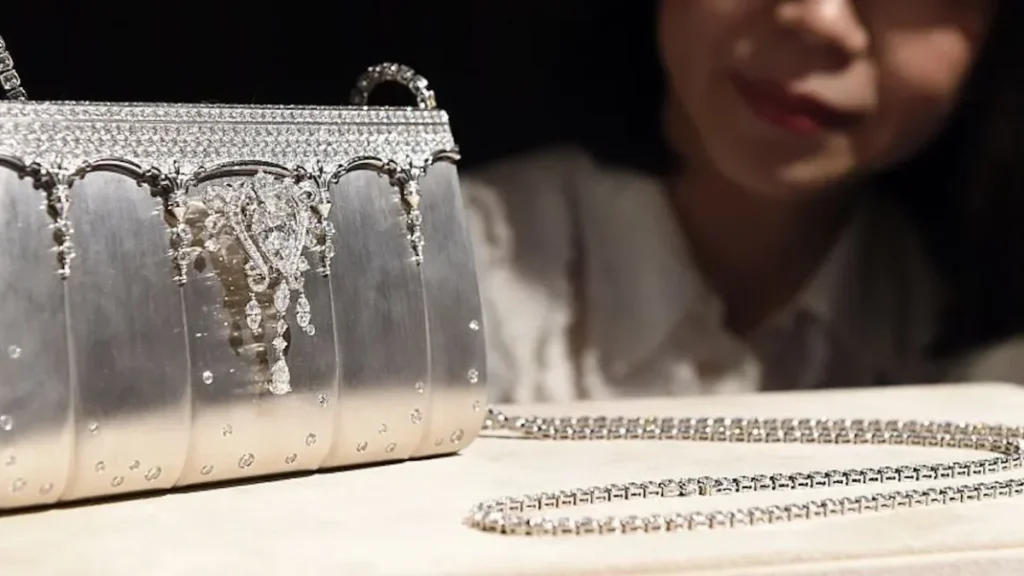 Diamond-encrusted silver designer clutch featured among the most expensive handbags.