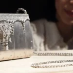 Diamond-encrusted silver designer clutch featured among the most expensive handbags.