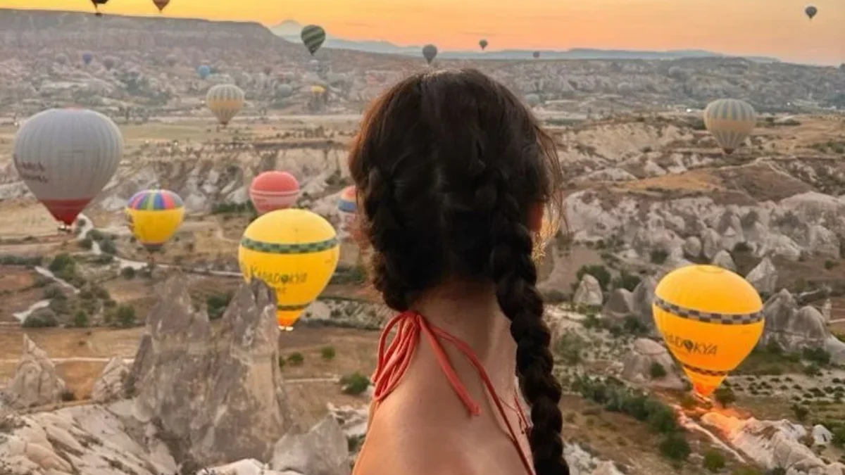 Sunrise hot air balloon flight over scenic landscape in one of the most exclusive travel destinations.